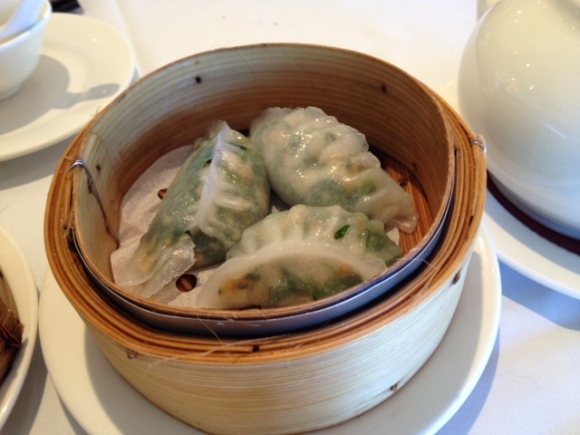 Steamed crab meat, scallop, prawn, and spinach dumpling